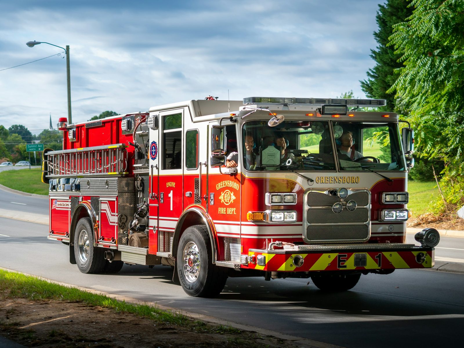 A fire engine driving down a road